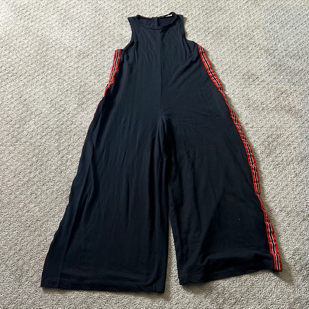 Zara Black oversized jumpsuit with red/white/black tuxedo stripe.